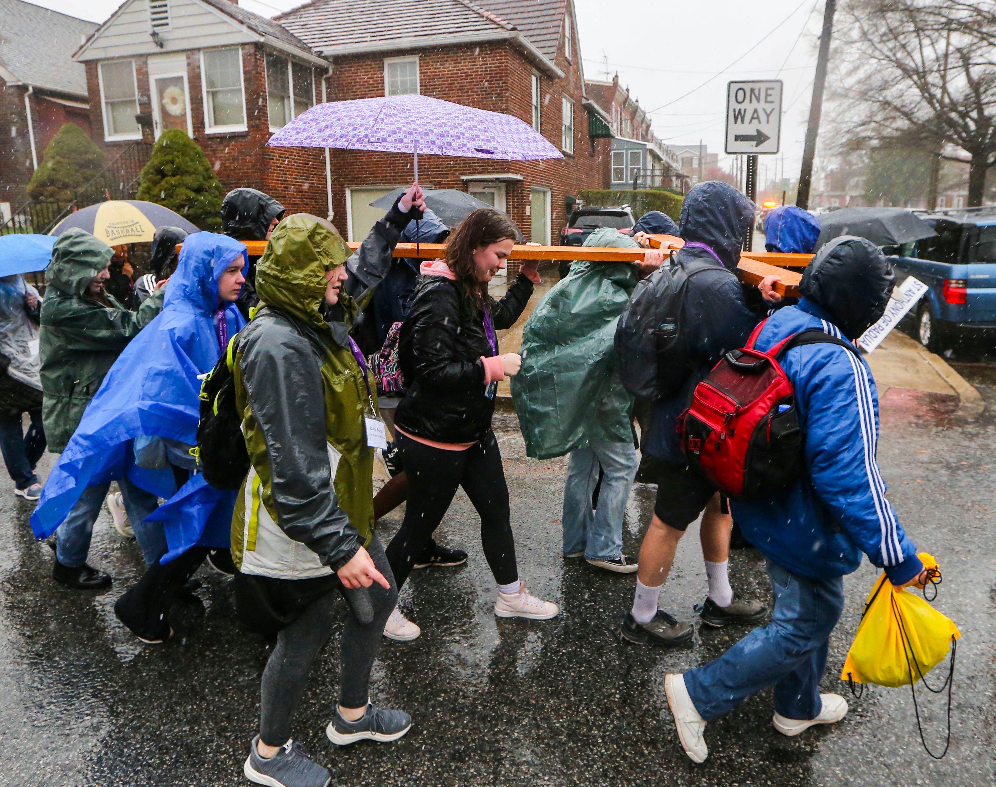 The Pilgrim Cross is carried on W. 10th Street as the Catholic Diocese of Wilmington's Catholic Youth Ministry cross pilgrimage heads for St. Anthony of Padua from its starting point at St. Elizabeth, Saturday, March 23, 2024.