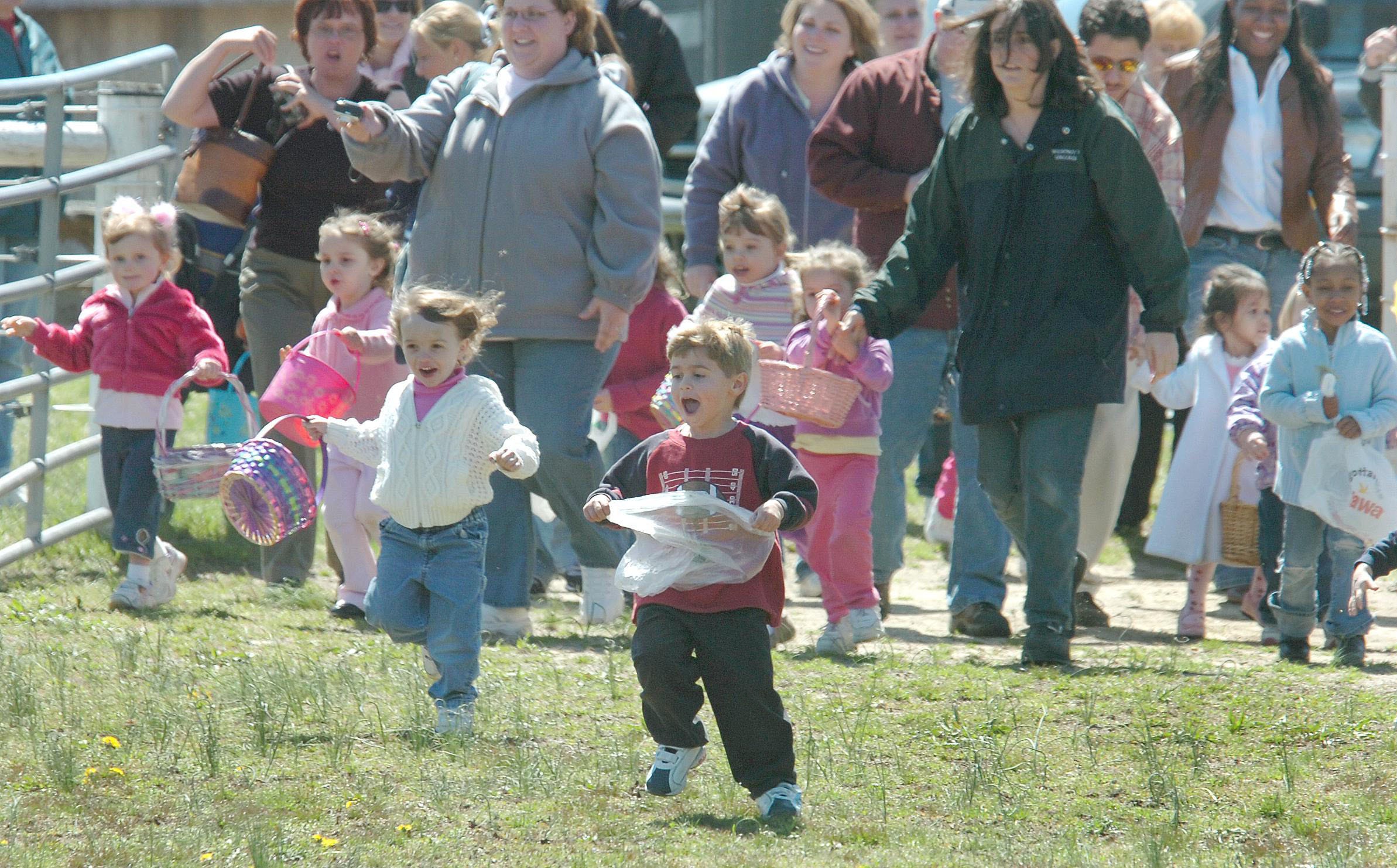 Kids at Sunset Stables head for the egg-laden pasture during egg hunt festivities on the farm at Lums Pond In 2006.